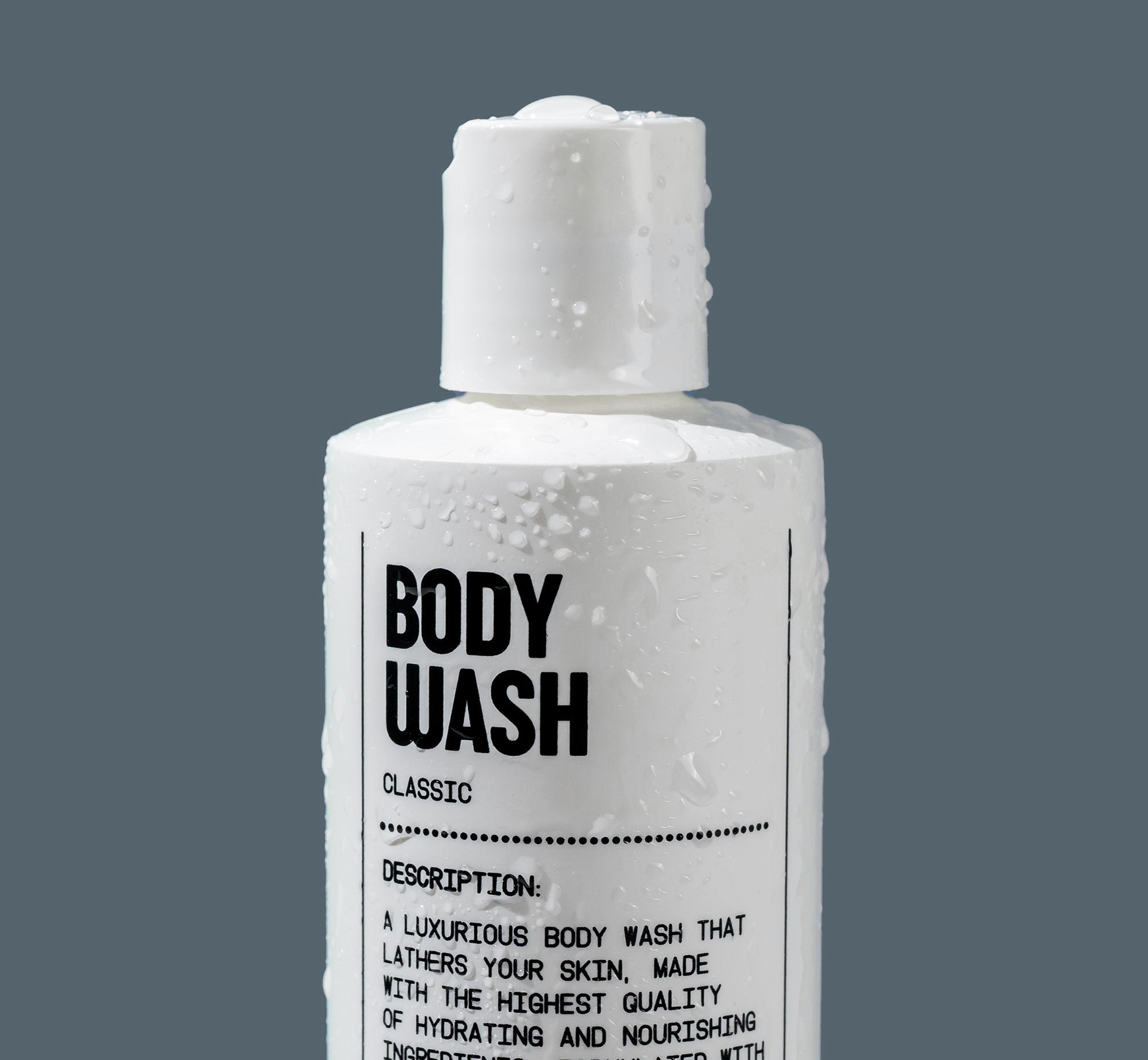 Bottle of body wash with a gray background