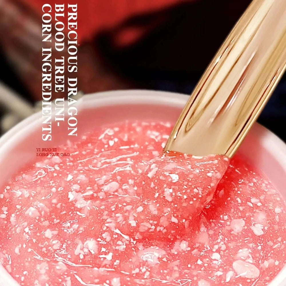 Close-up of a pink gel-like substance with a gold tool, branded 'Precious Dragon'.