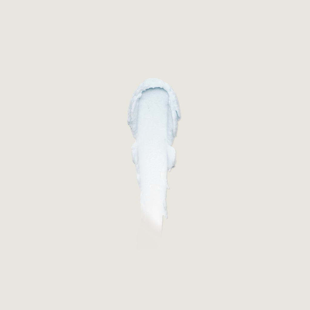 White ceramic vase on a beige background