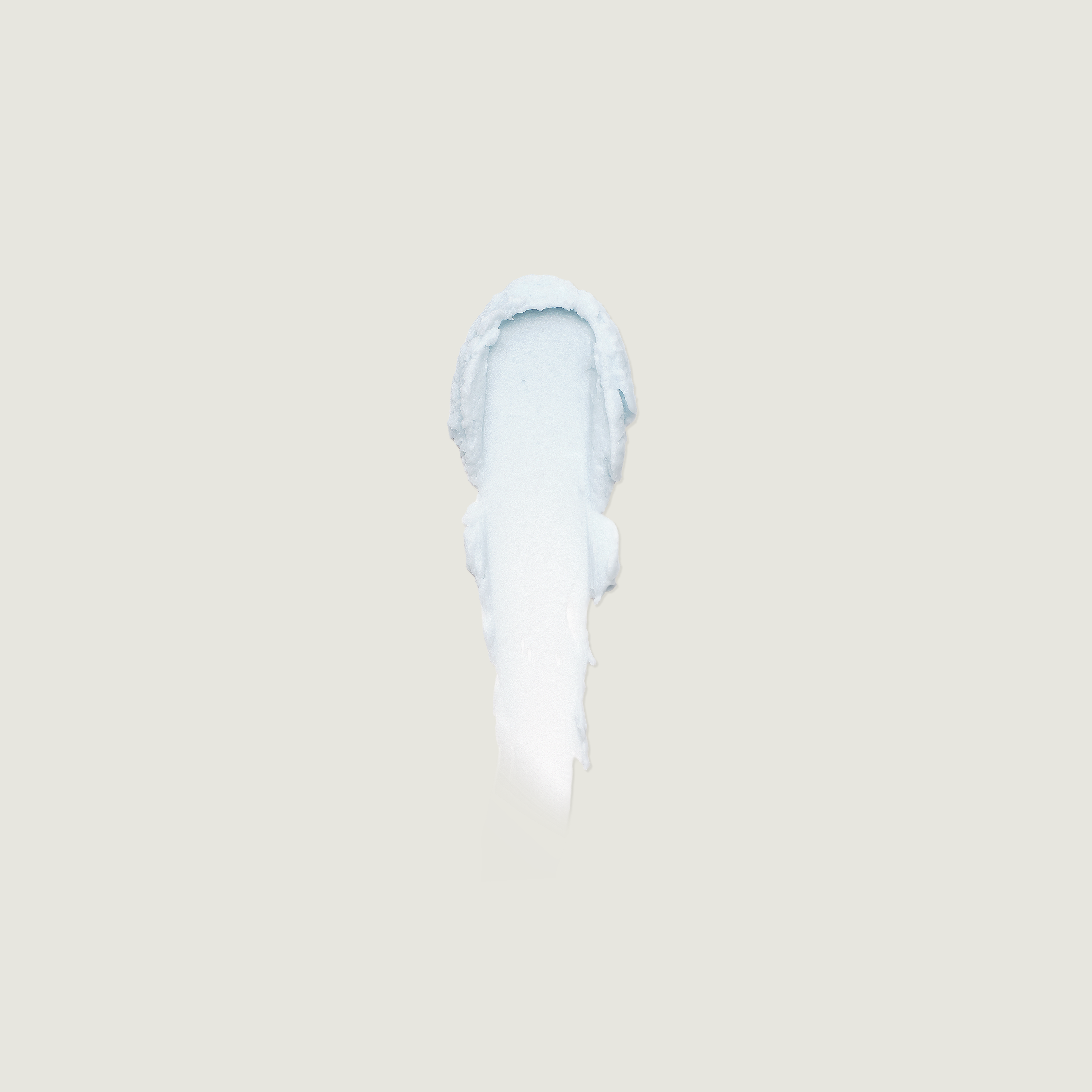White ceramic vase on a beige background