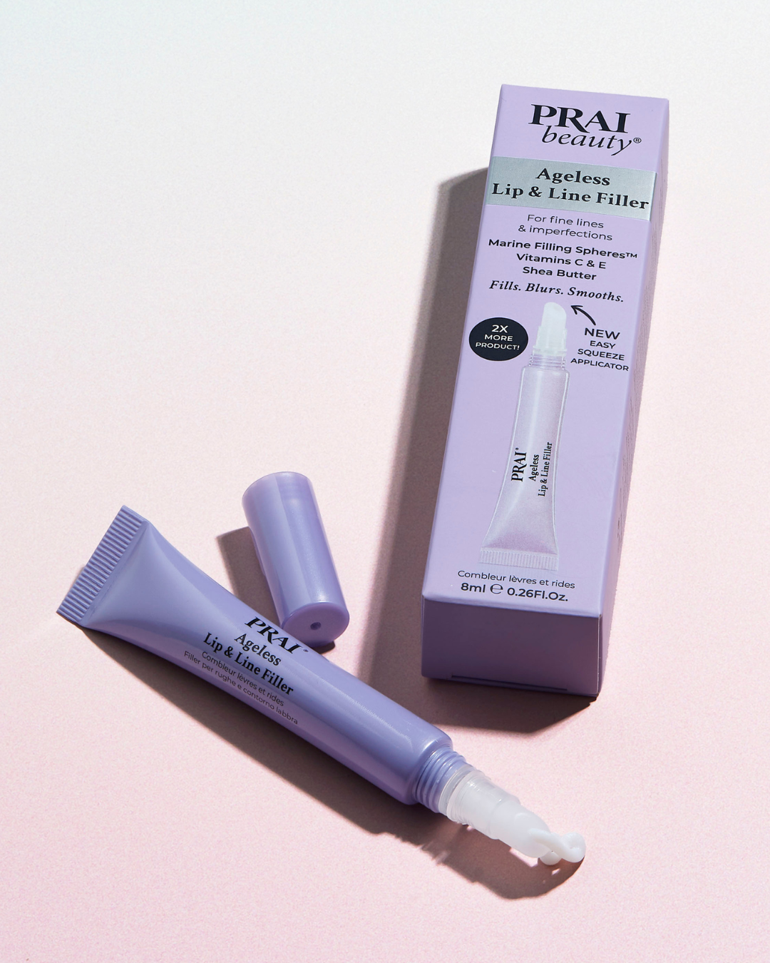 PRAI beauty lip and line filler with packaging on a light pink background
