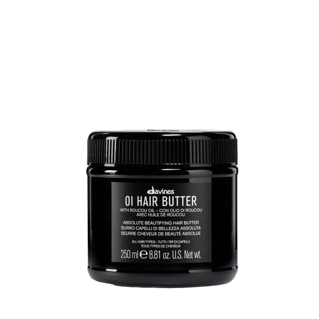 Black jar of Davines OI Hair Butter on a white background