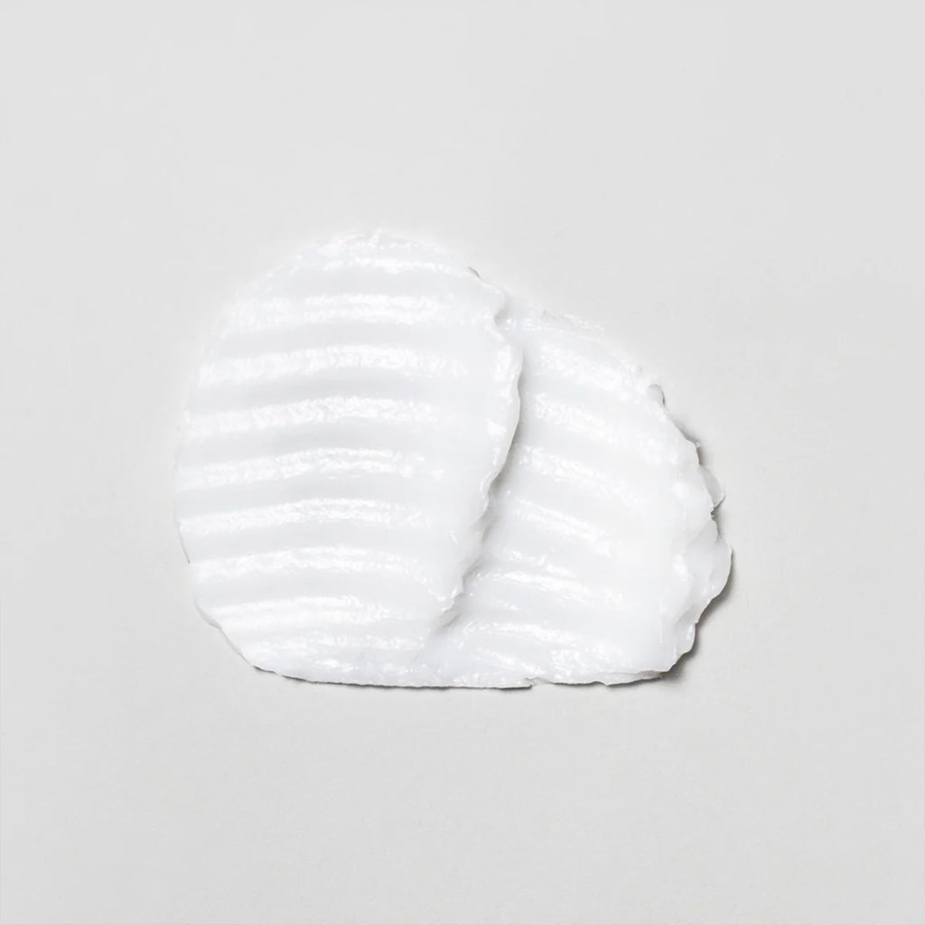 White cloud-like substance on a gray background