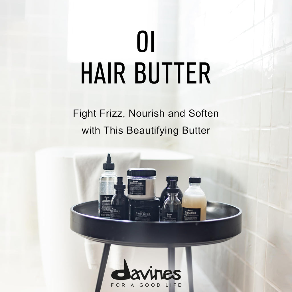Collection of Davines hair care products on a round black tray with promotional text.