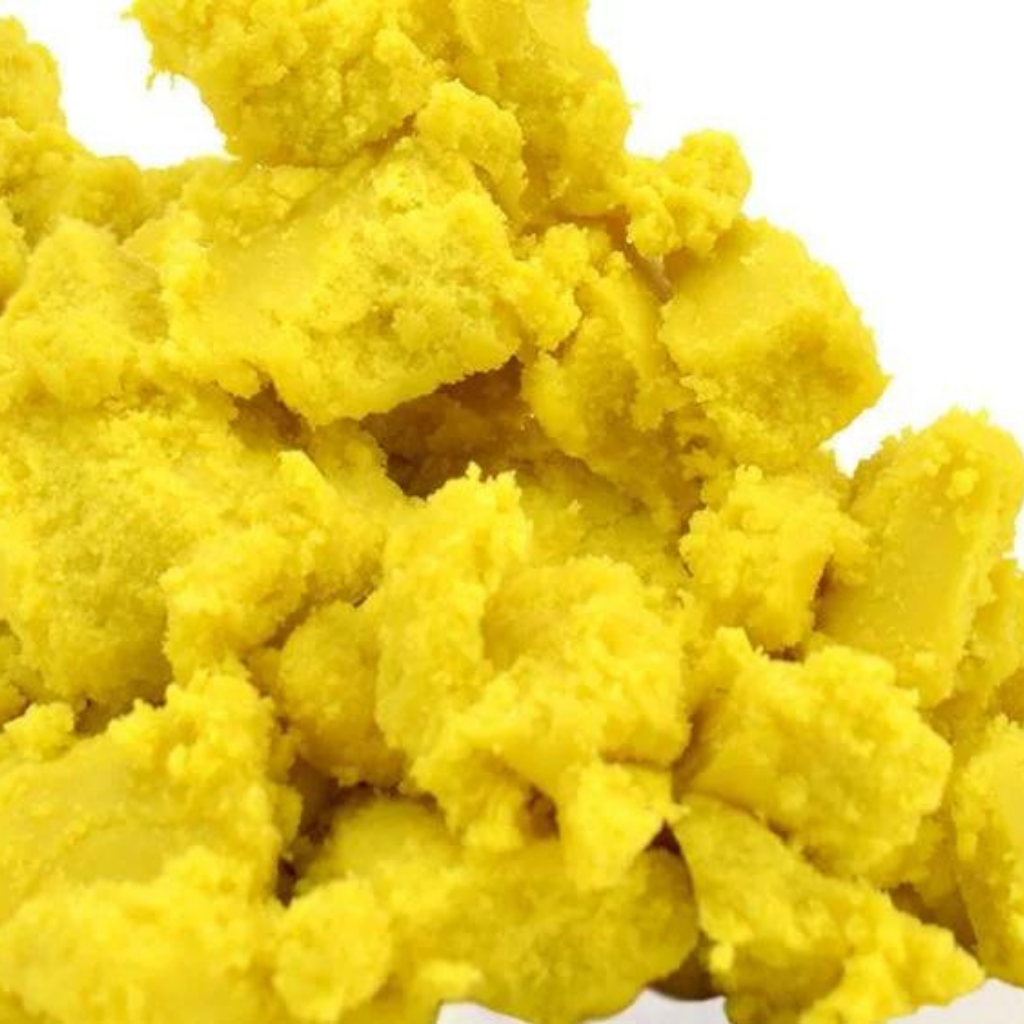 Close-up of yellow play dough on a white background