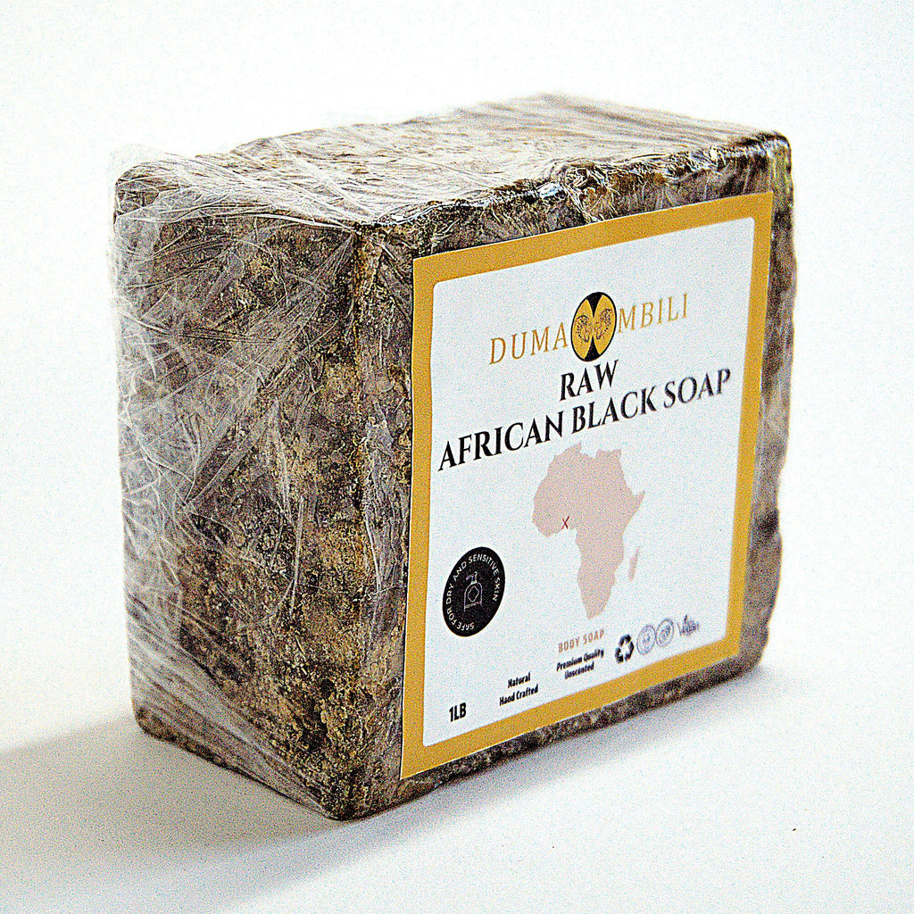 Raw African Black Soap bar with Dumaombili label on a white background