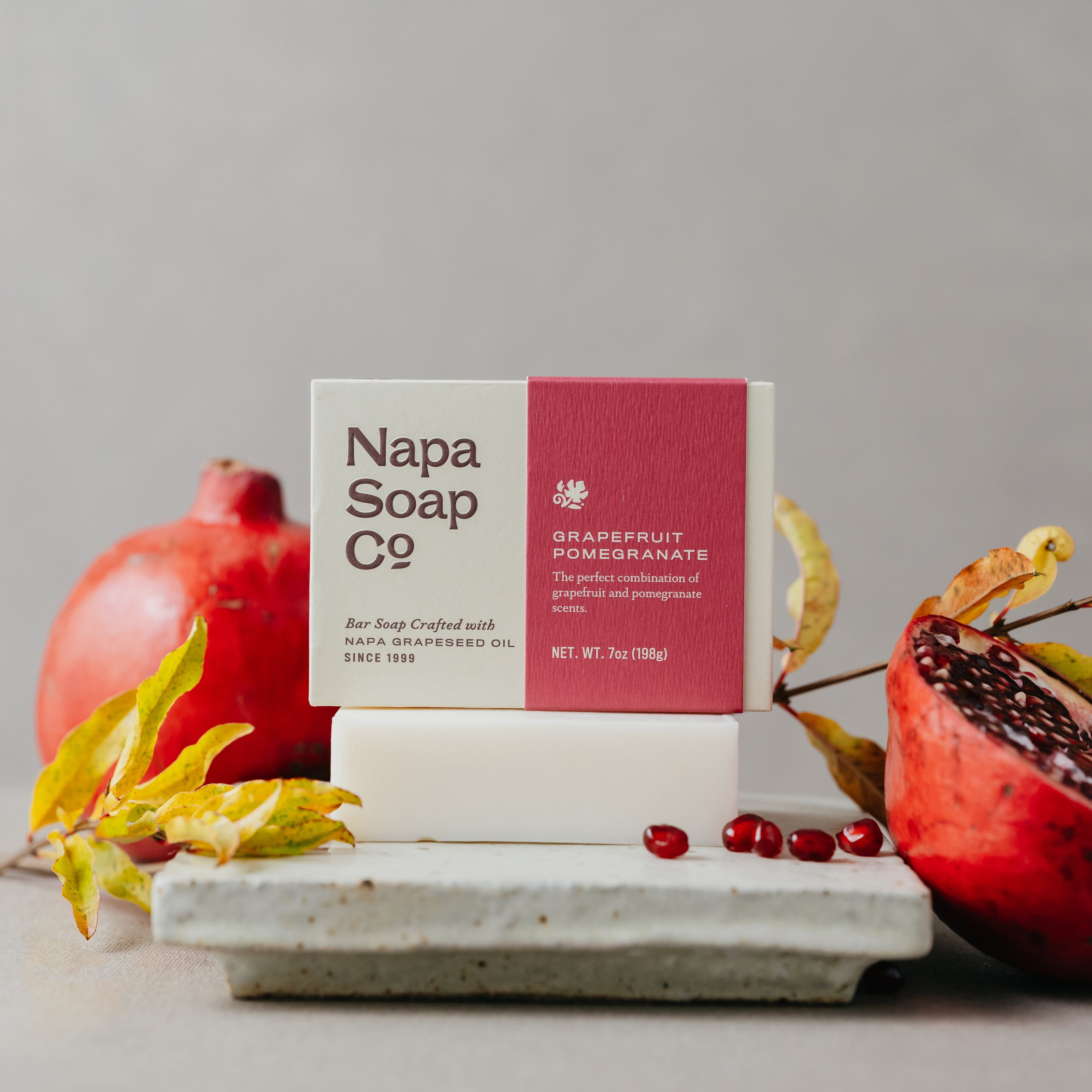 Napa Soap Co. grapefruit pomegranate soap bar with packaging on a neutral background