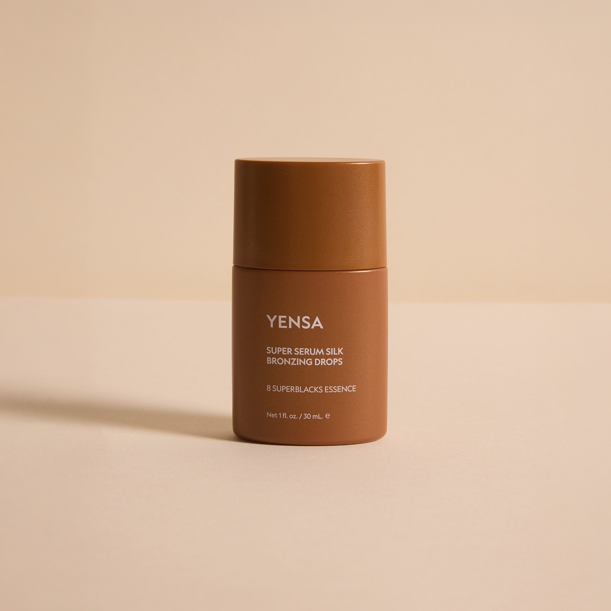 Brown bottle with 'Yensa' branding on a beige background