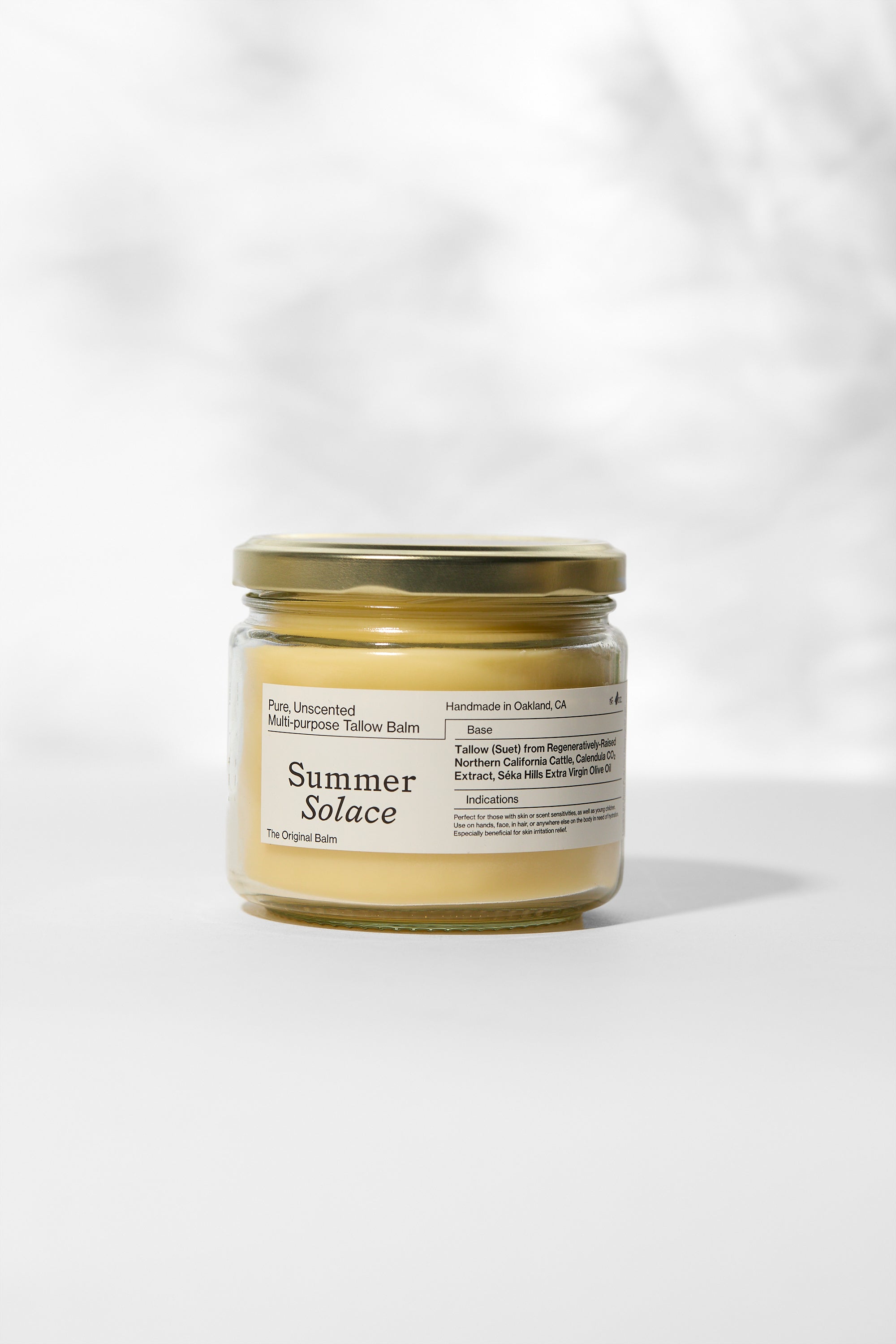 Jar of 'Summer Solace' balm on a white background