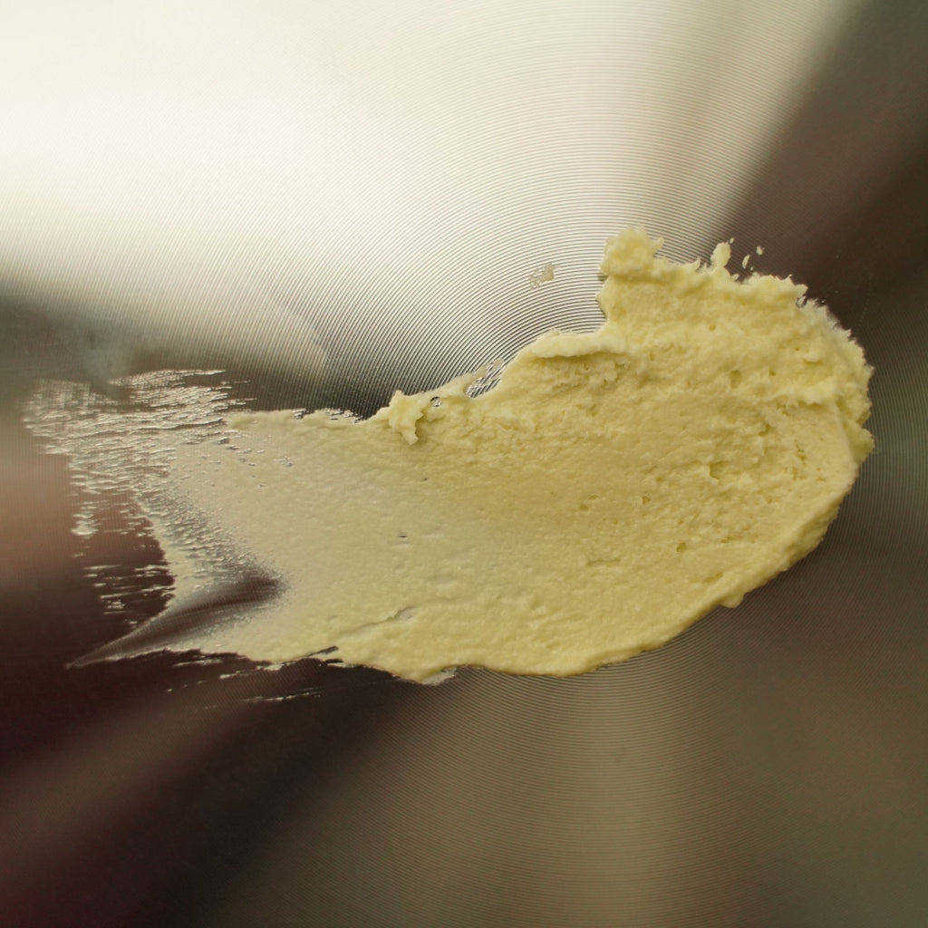 Close-up of a yellowish substance on a metallic surface
