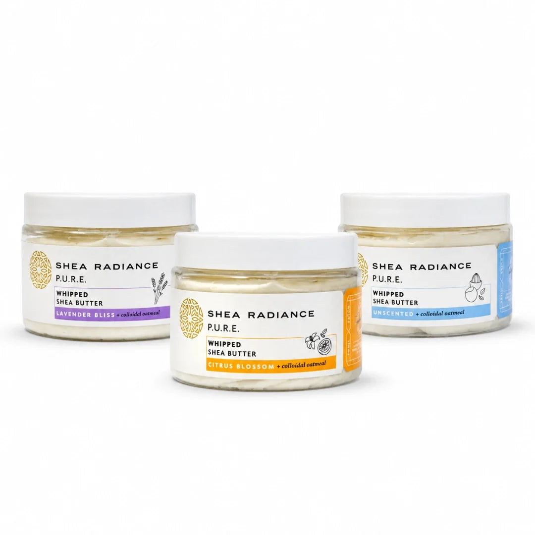 Three jars of Shea Radiance Pure whipped shea butter arranged on a white background, with lavender, mango butter, and unscented variants visible through clear jars with white lids and colorful labels.